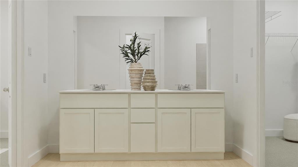 5108 Flaxleaf Street St. Cloud, FL 34772 - Photo 18 of 31 a bathroom with a sink and a mirror