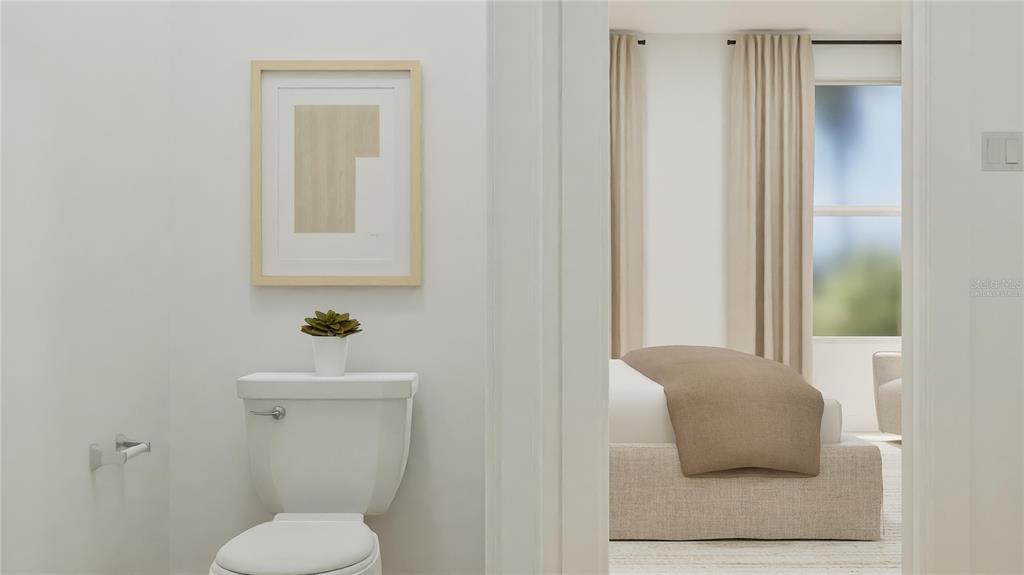 5108 Flaxleaf Street St. Cloud, FL 34772 - Photo 19 of 31 a white toilet sitting next to a bathroom sink