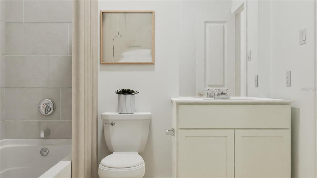 5108 Flaxleaf Street St. Cloud, FL 34772 - Photo 9 of 31 a bathroom with a sink a toilet and shower