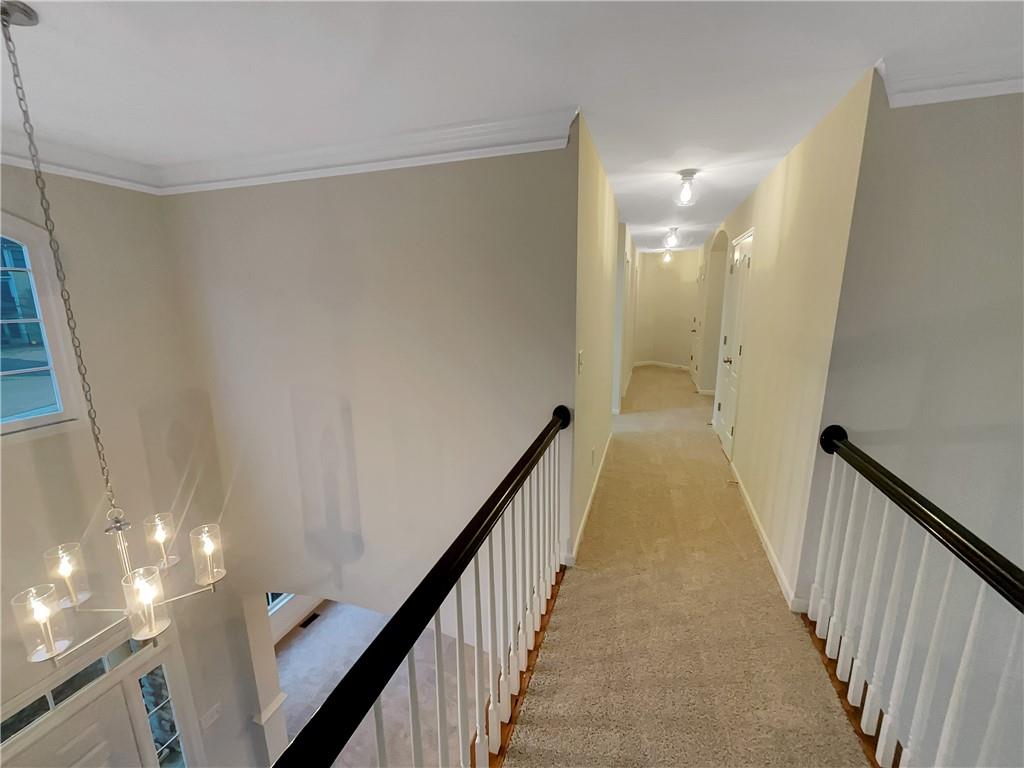 37 Ashdowne Way Acworth, GA 30101 - Photo 14 of 31 a view of a hallway with wooden floor