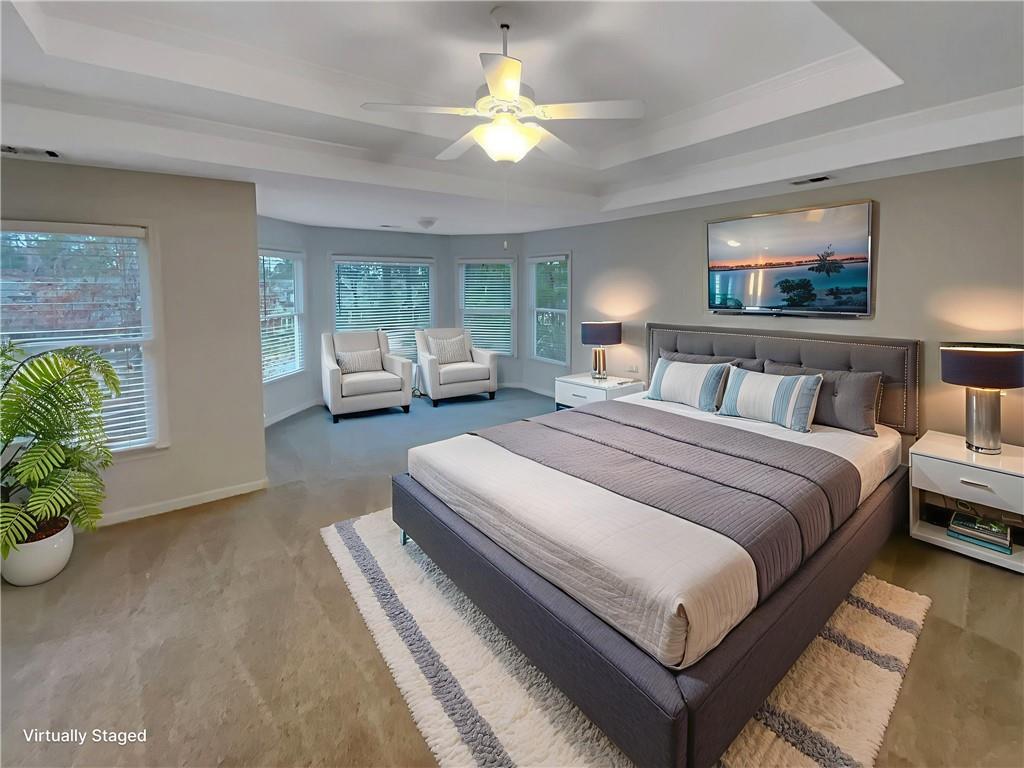 37 Ashdowne Way Acworth, GA 30101 - Photo 16 of 31 a spacious bedroom with a bed and a chandelier