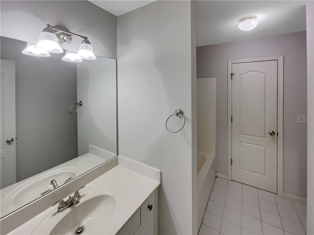 37 Ashdowne Way Acworth, GA 30101 - Photo 18 of 31 a bathroom with a sink vanity and a mirror