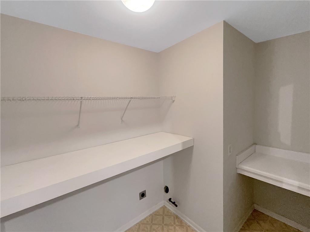 37 Ashdowne Way Acworth, GA 30101 - Photo 19 of 31 a room with linen closet and wooden floor