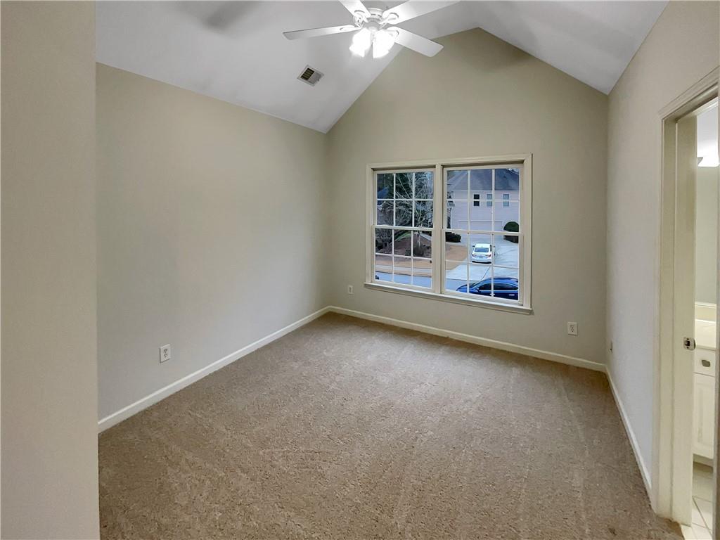 37 Ashdowne Way Acworth, GA 30101 - Photo 22 of 31 an empty room with window and ceiling fan
