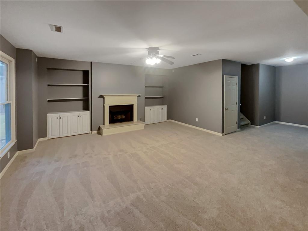 37 Ashdowne Way Acworth, GA 30101 - Photo 25 of 31 a view of an empty room with a fireplace and cabinet