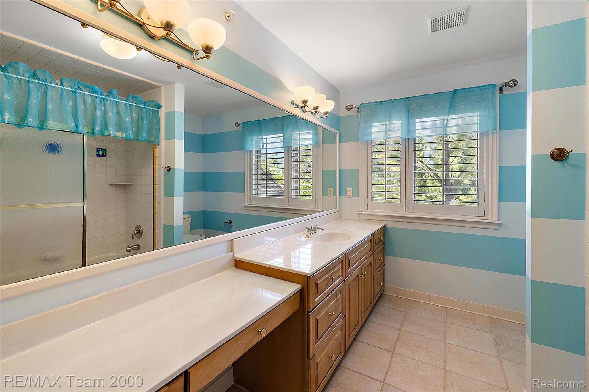 630 Sheldon Court Rochester, MI 48306 - Photo 58 of 94 Full bath with vanity, shower / bath combination with curtain, and light tile patterned flooring