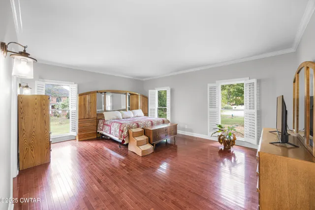 a large bathroom with a double vanity sink a mirror and a bathtub