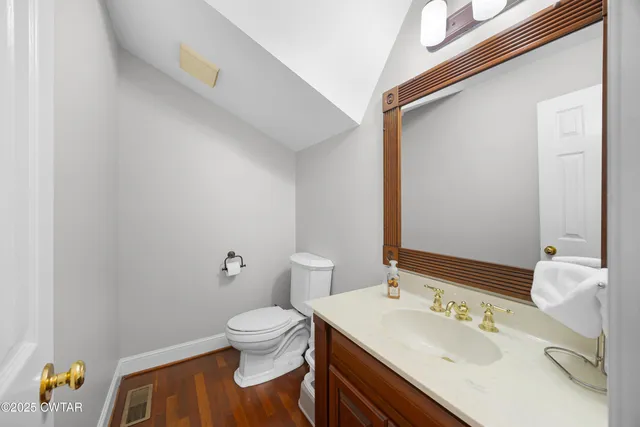 a kitchen with granite countertop cabinets a sink a counter and stainless steel appliances