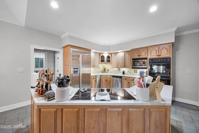 a kitchen with sink and window