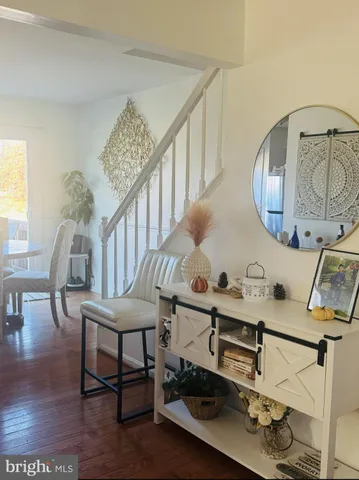 a room with furniture and wooden floor