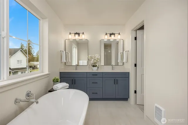 a bathroom with a tub and shower