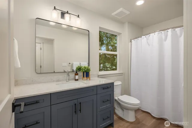 a view of room with hardwood floor