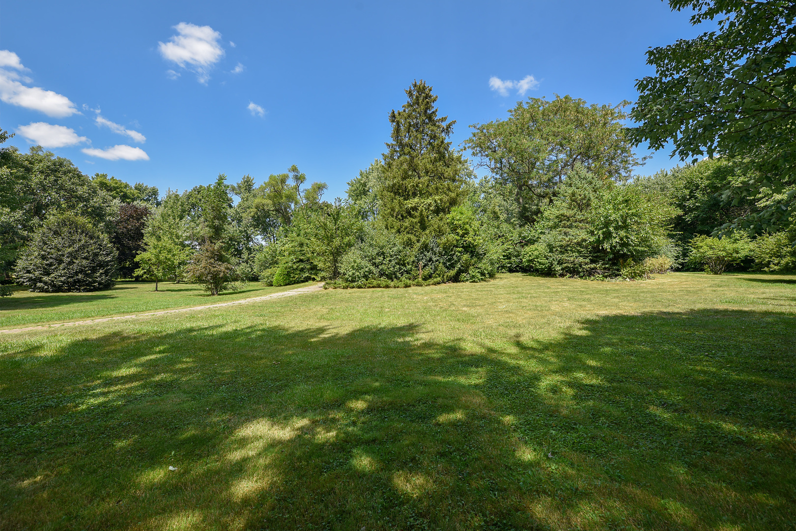 449 Cumnock Road Inverness, IL 60067 - Photo 3 of 10 a view of green field with trees in the background