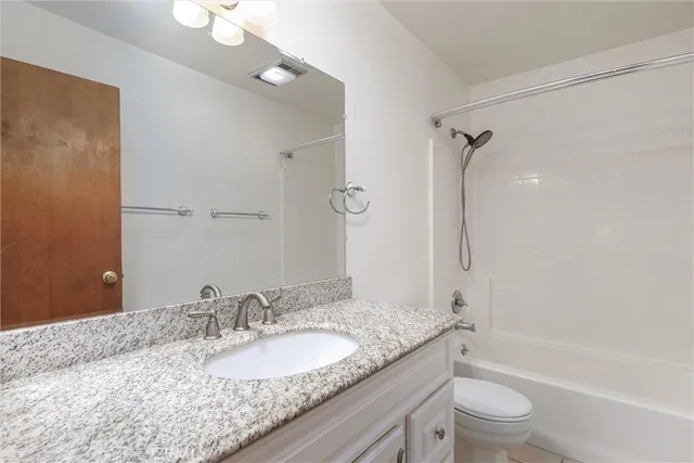 a view of a balcony with flower plants