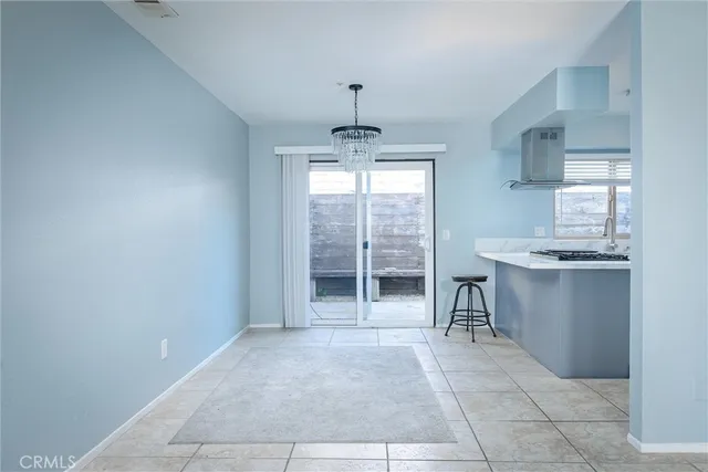 a kitchen with stainless steel appliances a sink a stove and a refrigerator