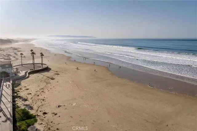 a view of an ocean and a mountain