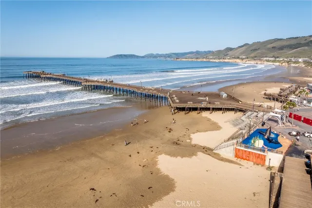an aerial view of residential houses with city view