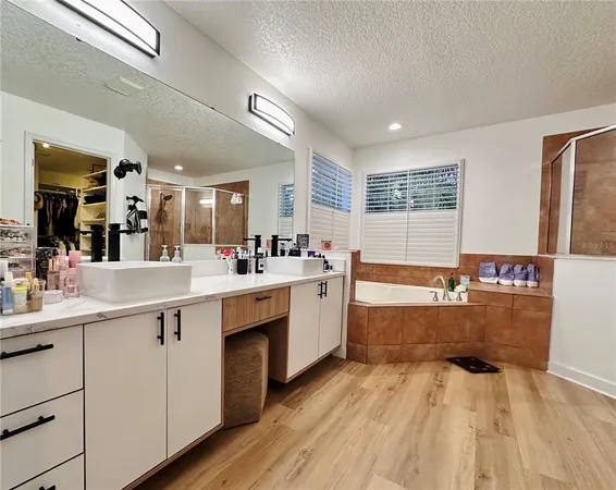 a kitchen with sink cabinets and wooden floor