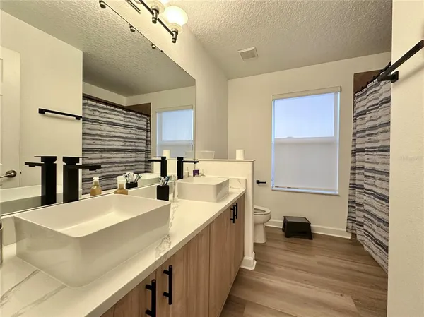 a kitchen with a sink and a refrigerator
