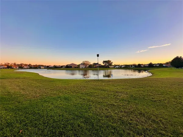 a view of a ocean with outside a house
