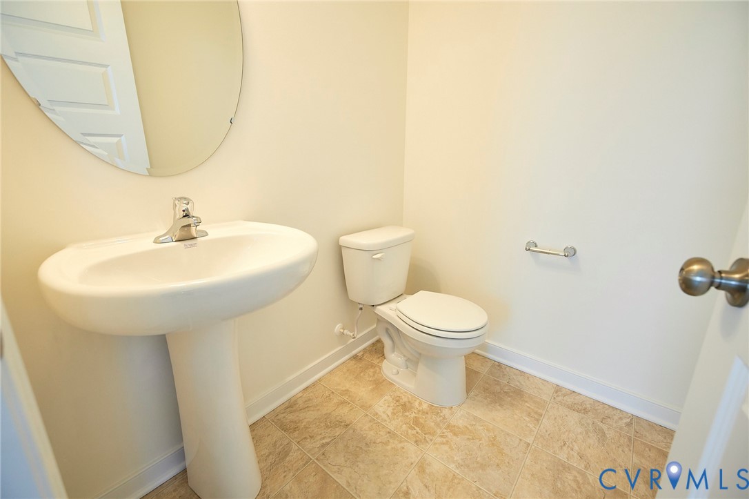214 Greenpark Road Sandston, VA 23150 - Photo 15 of 50 Half bath with baseboards and light tile patterned
