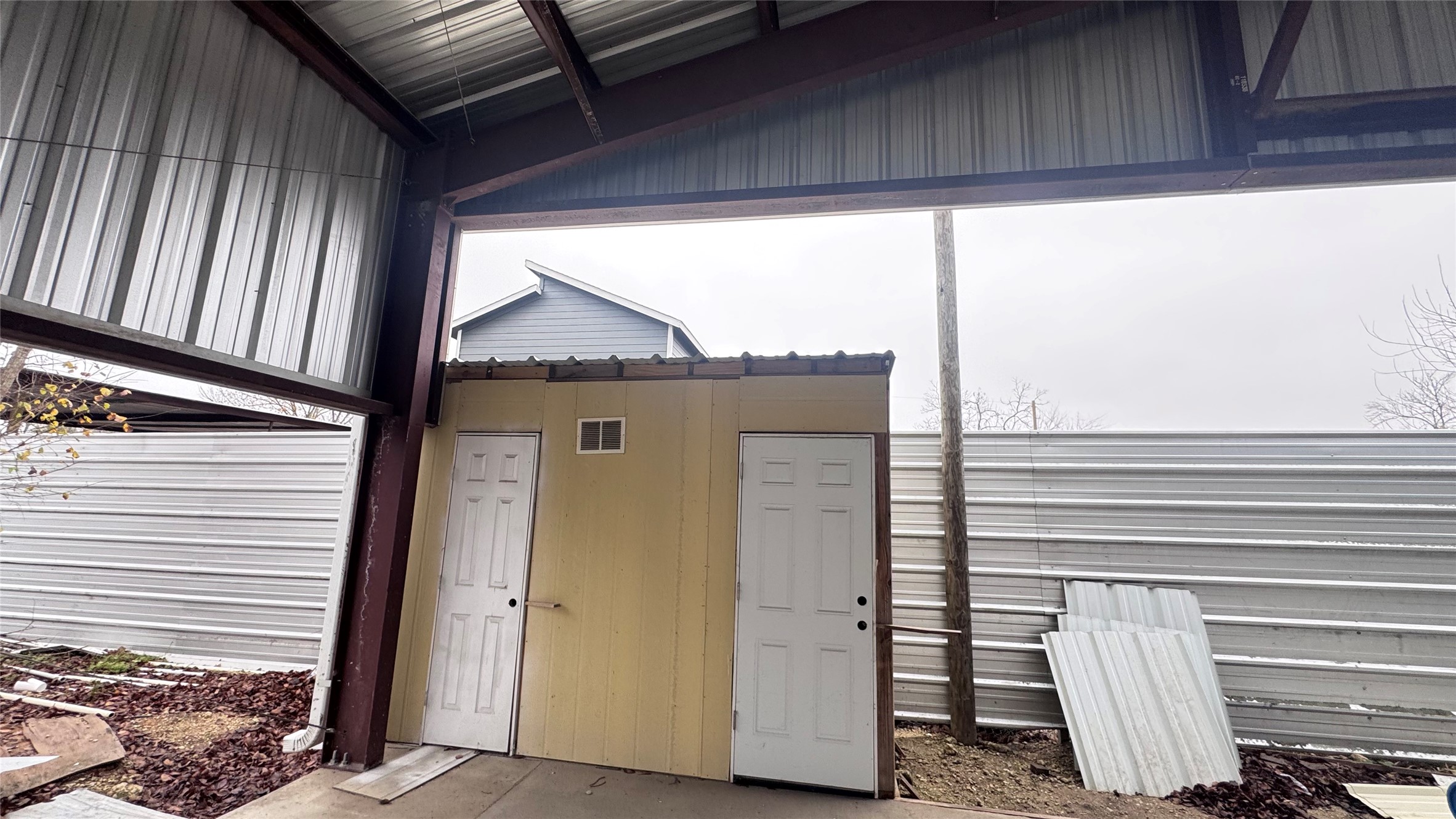 6315 Haight Street Houston, TX 77028 - Photo 15 of 23 a view of a house with a door and wooden walls