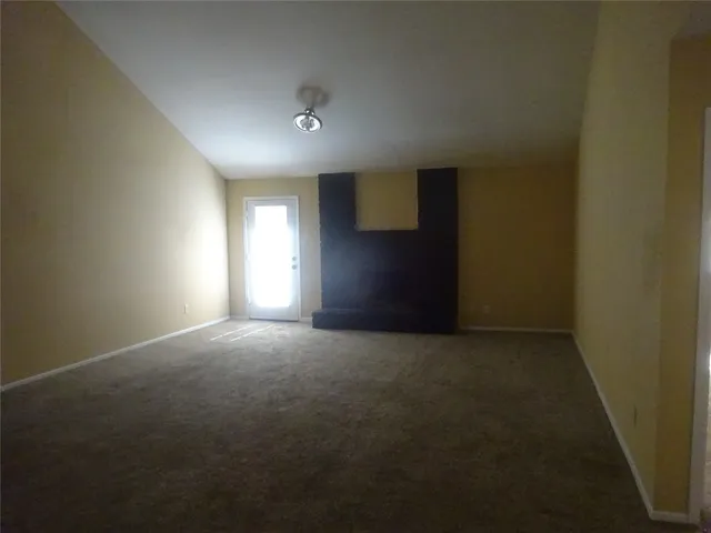 a kitchen with wooden cabinets and a stove top oven