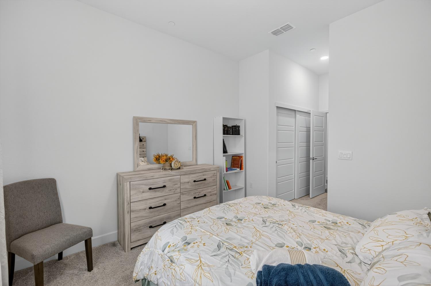 5603 Drifton Way Sacramento, CA 95835 - Photo 11 of 49 a bedroom with a bed and a chair