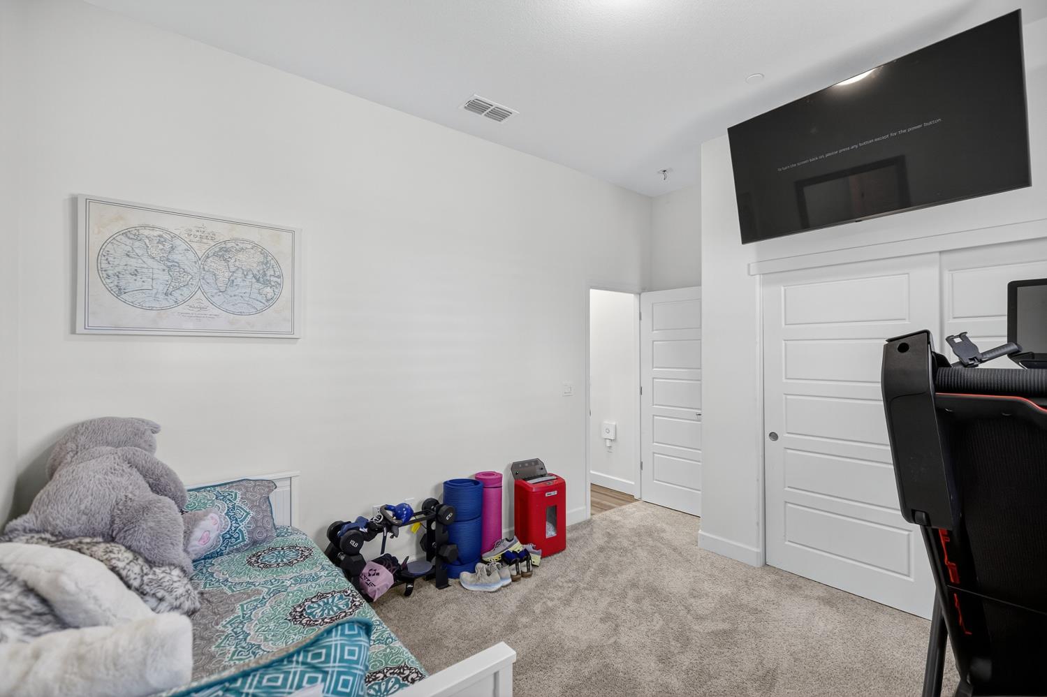 5603 Drifton Way Sacramento, CA 95835 - Photo 16 of 49 a living room with furniture and a flat screen tv