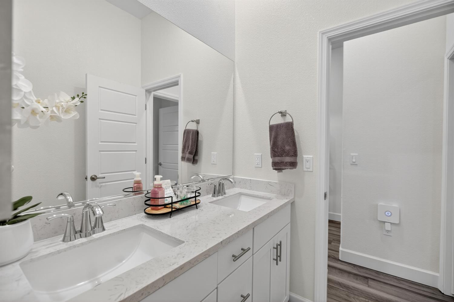 5603 Drifton Way Sacramento, CA 95835 - Photo 19 of 49 a bathroom with a sink and a mirror
