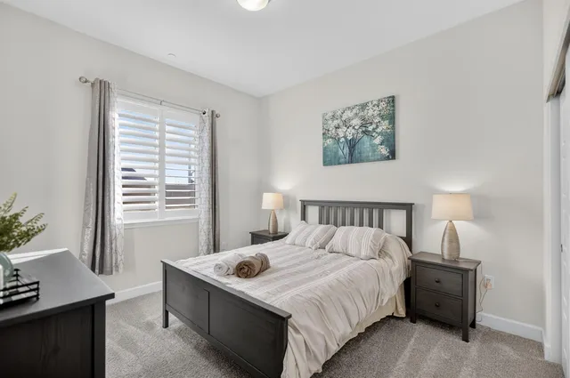 a bedroom with a bed and a cabinets