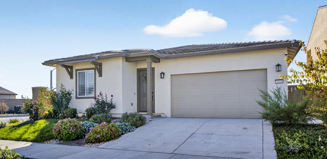 5603 Drifton Way Sacramento, CA 95835 - Photo 2 of 49 a front view of a house with garden