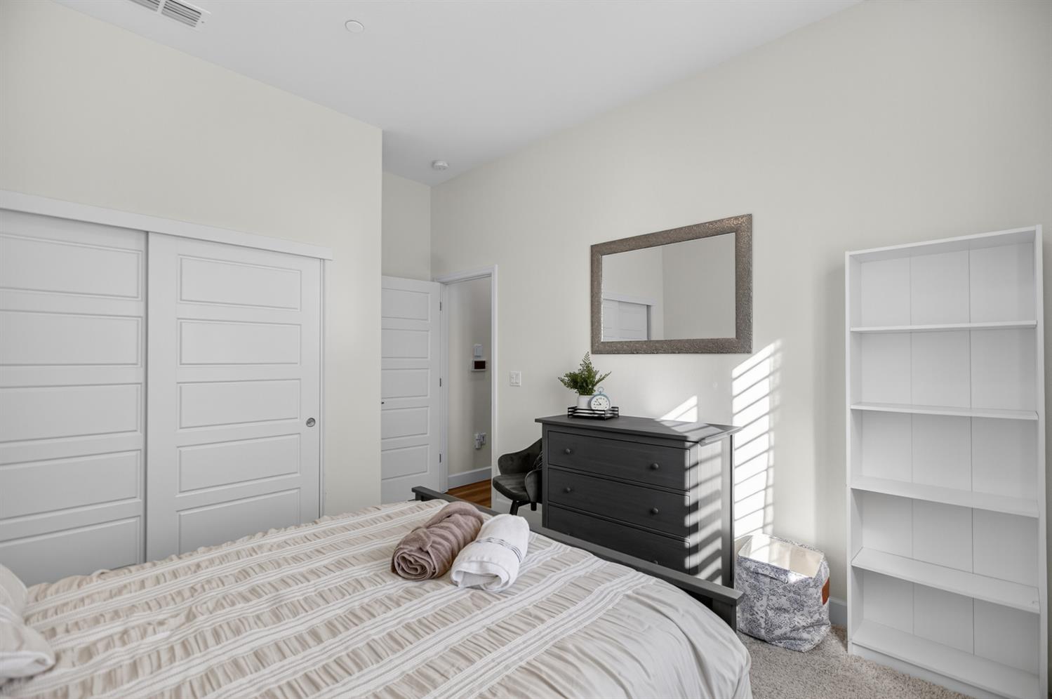 5603 Drifton Way Sacramento, CA 95835 - Photo 21 of 49 a bedroom with a bed and a cabinets