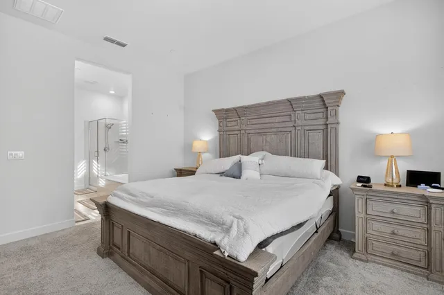 a spacious bathroom with a granite countertop tub sink shower and mirror