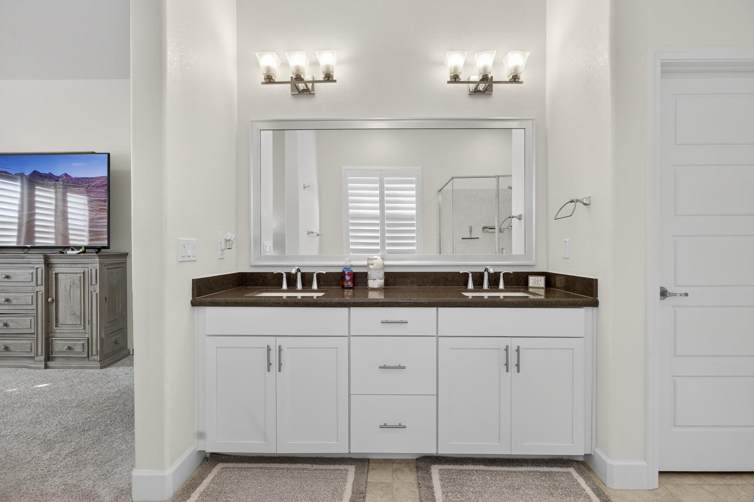 5603 Drifton Way Sacramento, CA 95835 - Photo 37 of 49 a bathroom with a sink and a mirror