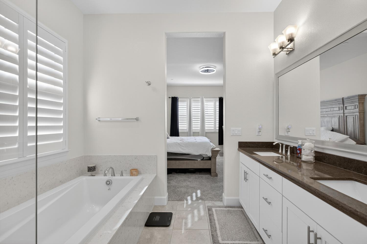 5603 Drifton Way Sacramento, CA 95835 - Photo 38 of 49 a en suite spacious bathroom with a tub double vanity and windows