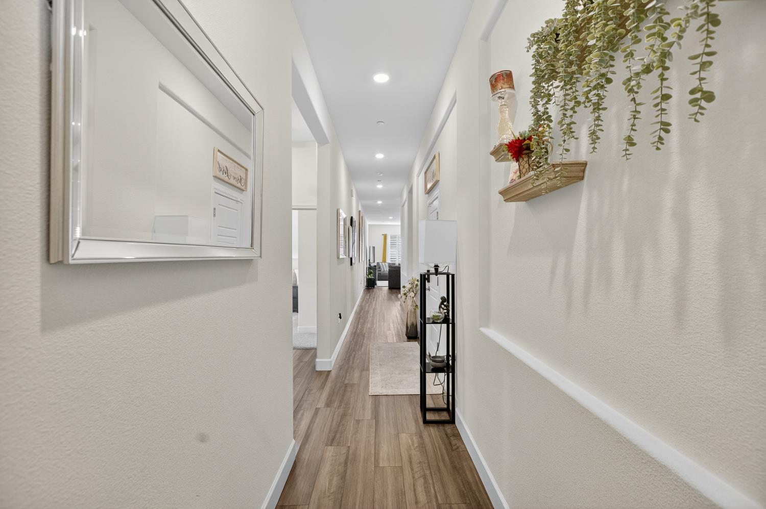 5603 Drifton Way Sacramento, CA 95835 - Photo 6 of 49 a view of a hallway with wooden floor and staircase