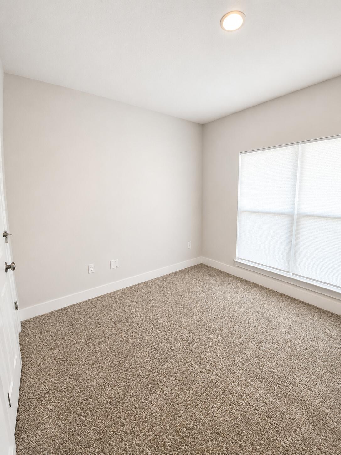734 Quintana Street Crestview, FL 32539 - Photo 5 of 16 an empty room with a window