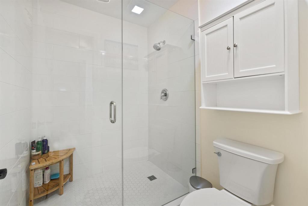 6734 Bridlewood Court, Unit 6734 Boca Raton, FL 33433 - Photo 23 of 42 a bathroom with a shower a toilet and sink