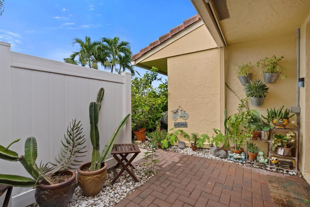 6734 Bridlewood Court, Unit 6734 Boca Raton, FL 33433 - Photo 3 of 42 a view of a backyard with plants and entertaining space