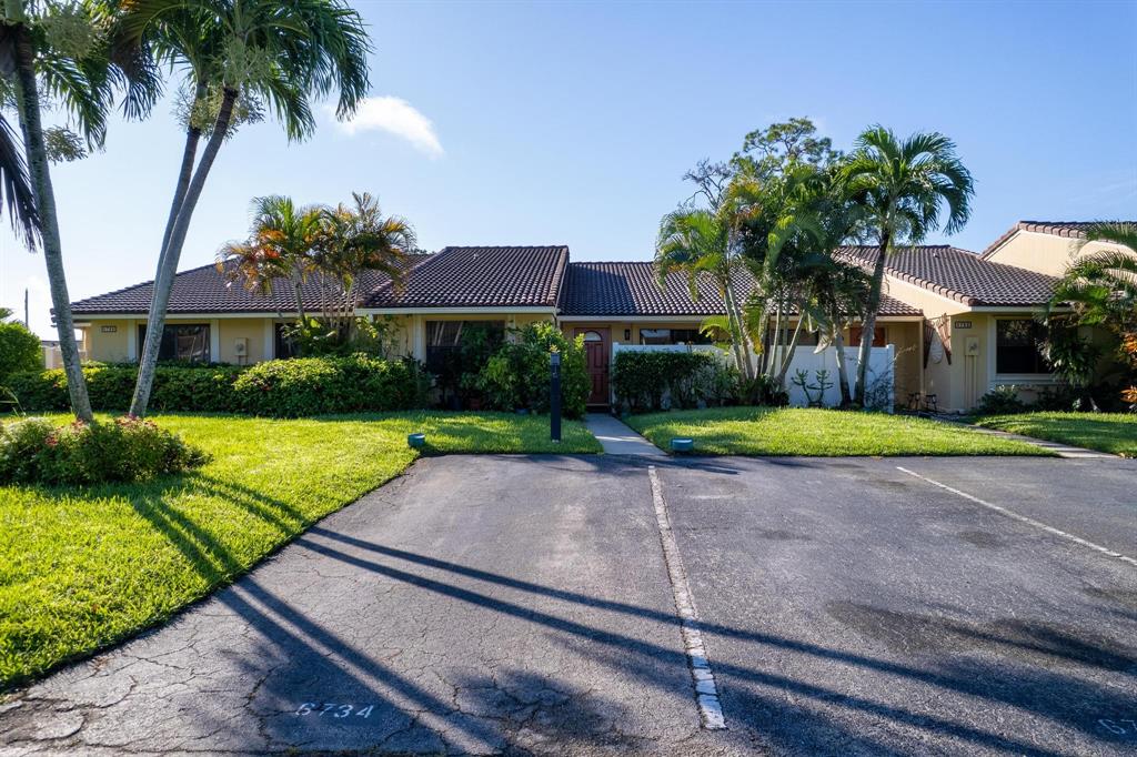 6734 Bridlewood Court, Unit 6734 Boca Raton, FL 33433 - Photo 31 of 42 a house with garden in front of it