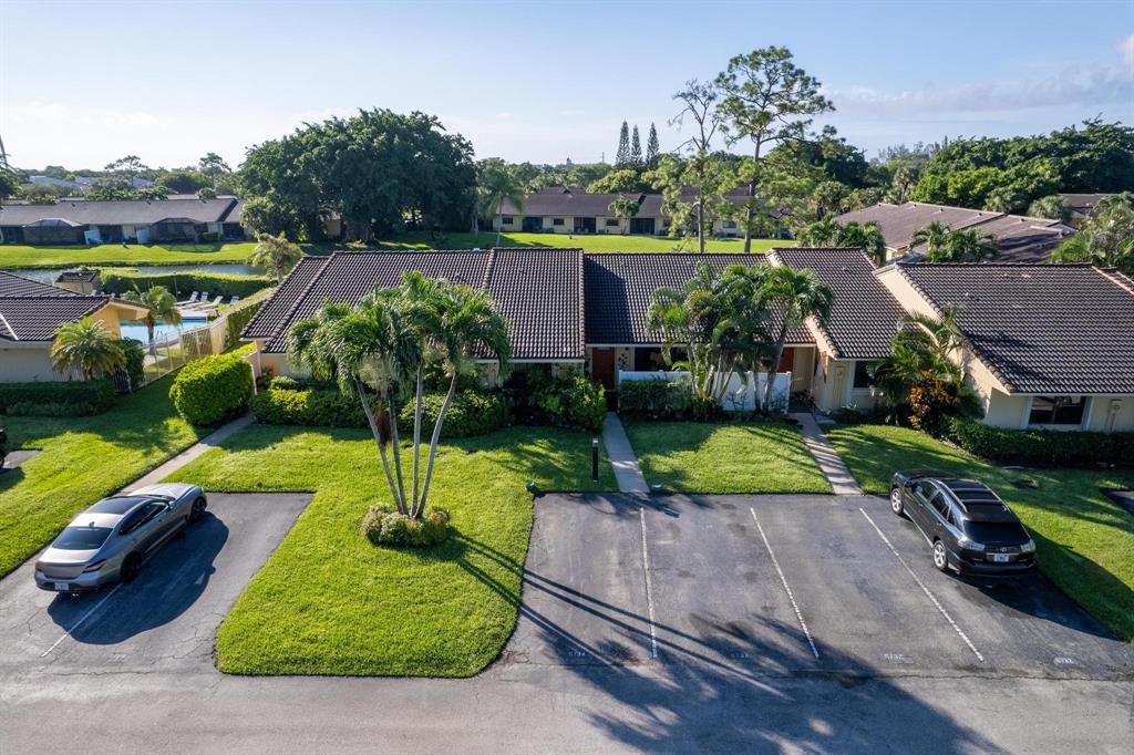 6734 Bridlewood Court, Unit 6734 Boca Raton, FL 33433 - Photo 32 of 42 a view of yard with swimming pool and green space