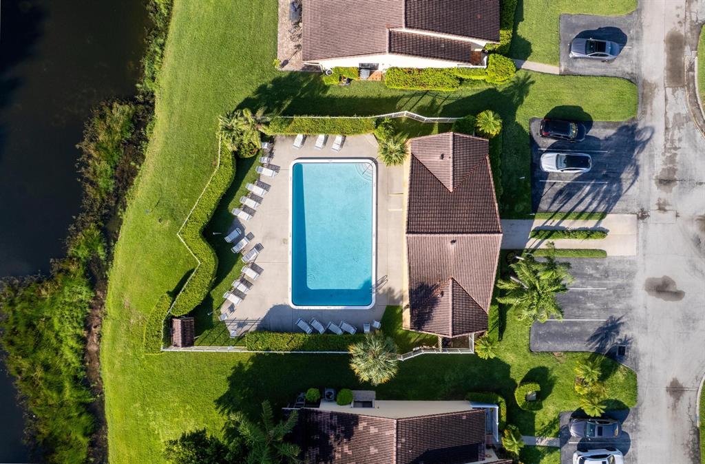 6734 Bridlewood Court, Unit 6734 Boca Raton, FL 33433 - Photo 38 of 42 an aerial view of a house with a yard and a large pool