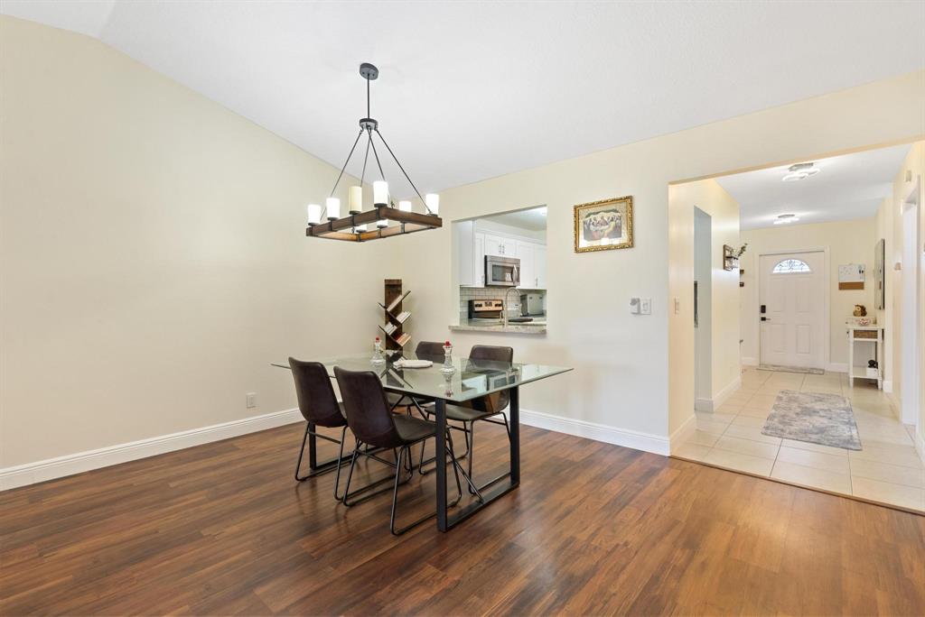 6734 Bridlewood Court, Unit 6734 Boca Raton, FL 33433 - Photo 10 of 42 a view of a dining room with furniture and wooden floor