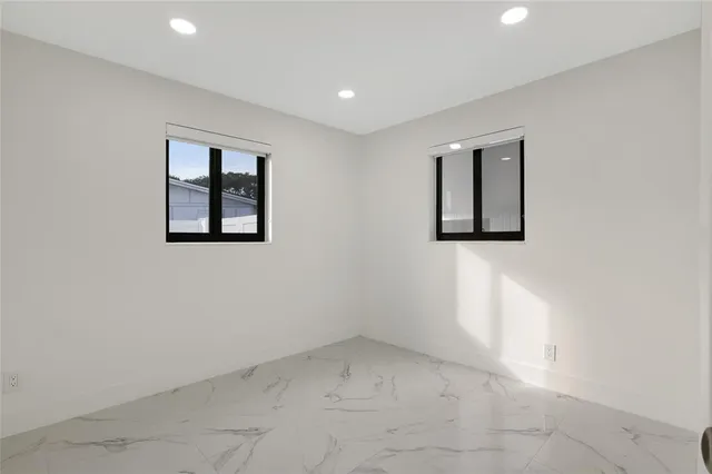 an empty room with windows