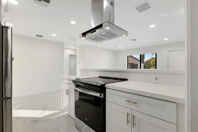 a kitchen with a stove and a sink