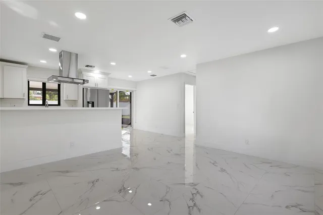a view of a large kitchen with a sink