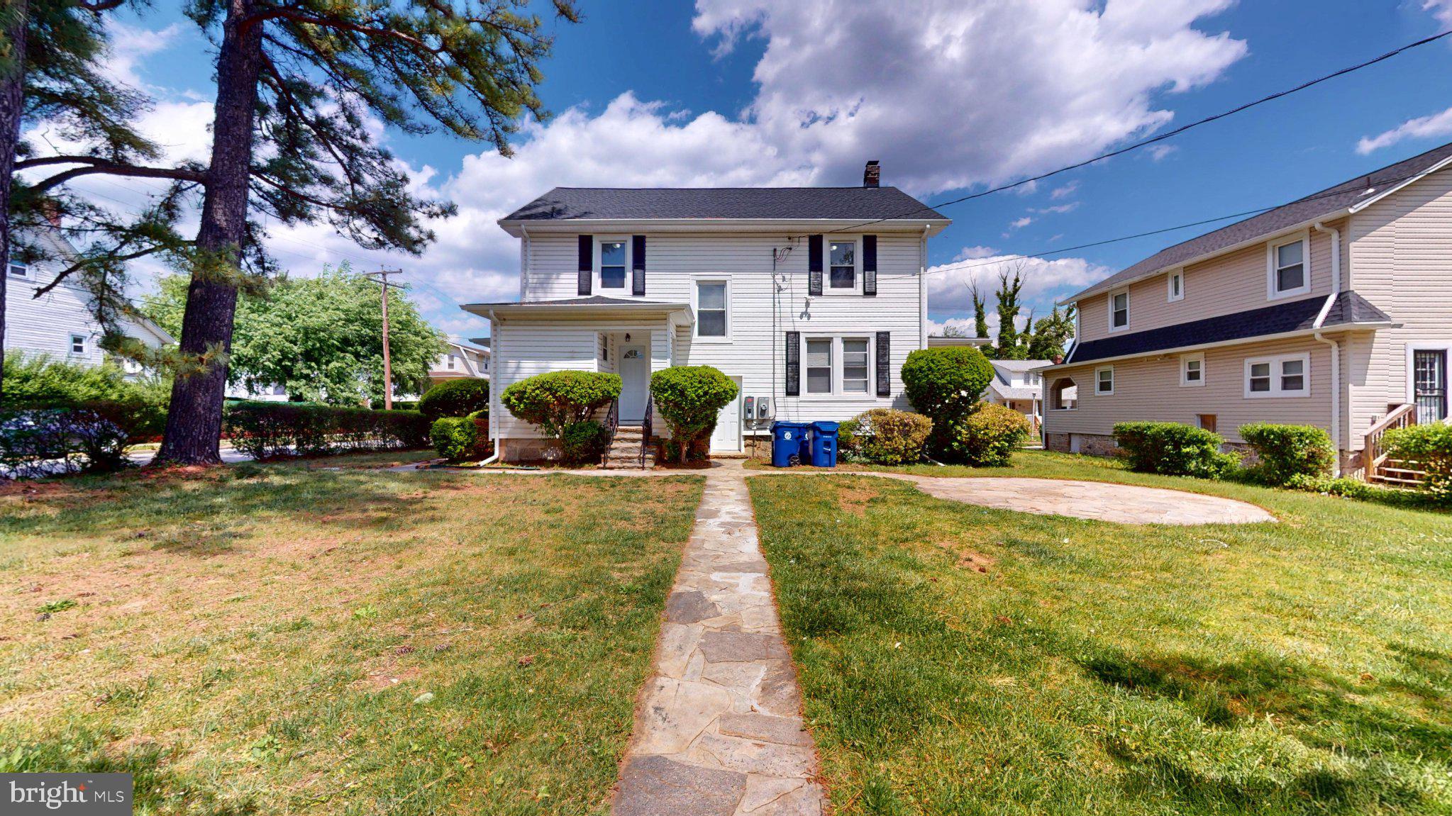 5728 Clover Road Baltimore, MD 21215 - Photo 2 of 37 Charming home with lush greenery.
