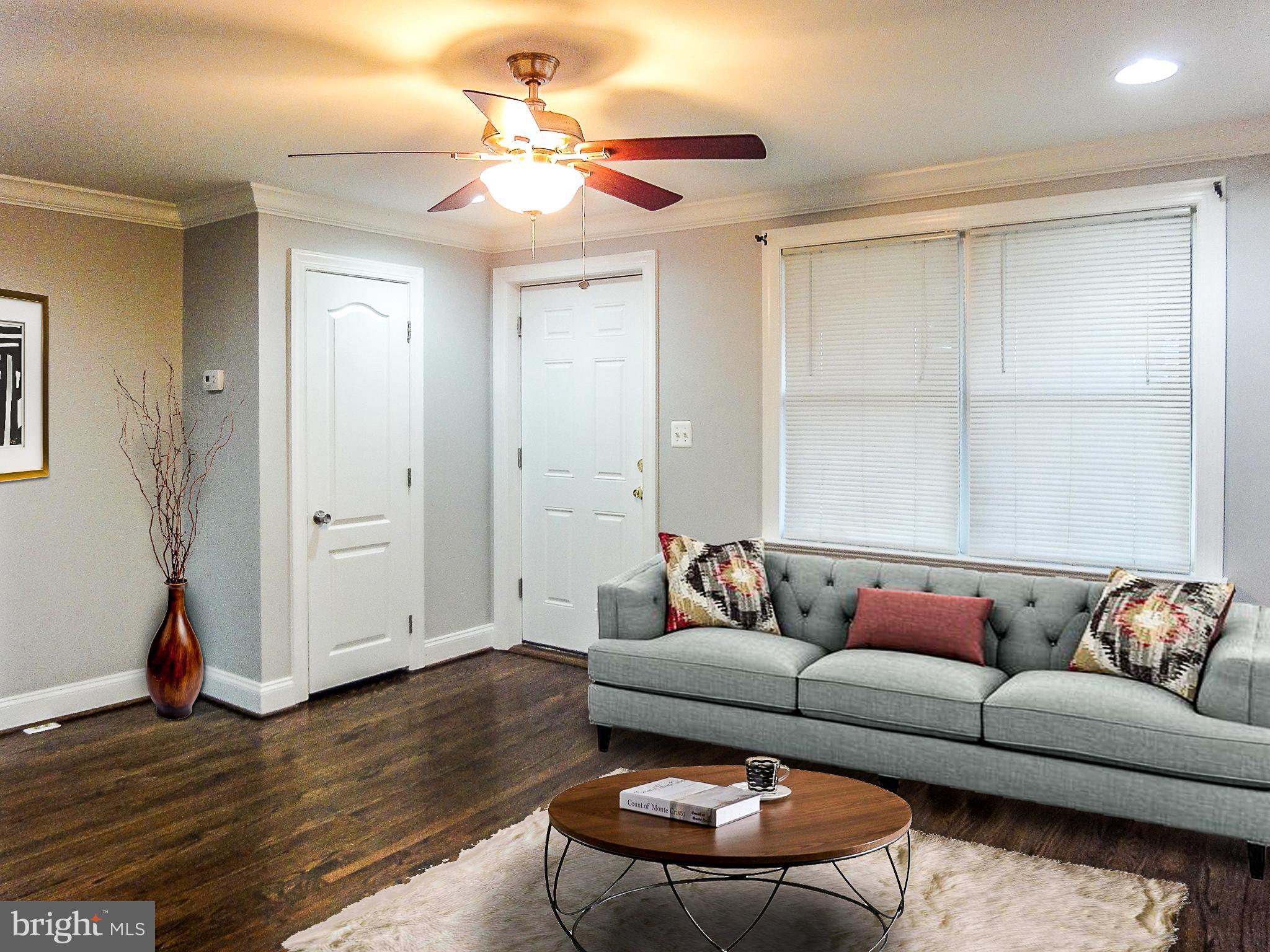 1803 Dunmere Road Baltimore, MD 21222 - Photo 1 of 14 Living room with newly stained hardwood floors