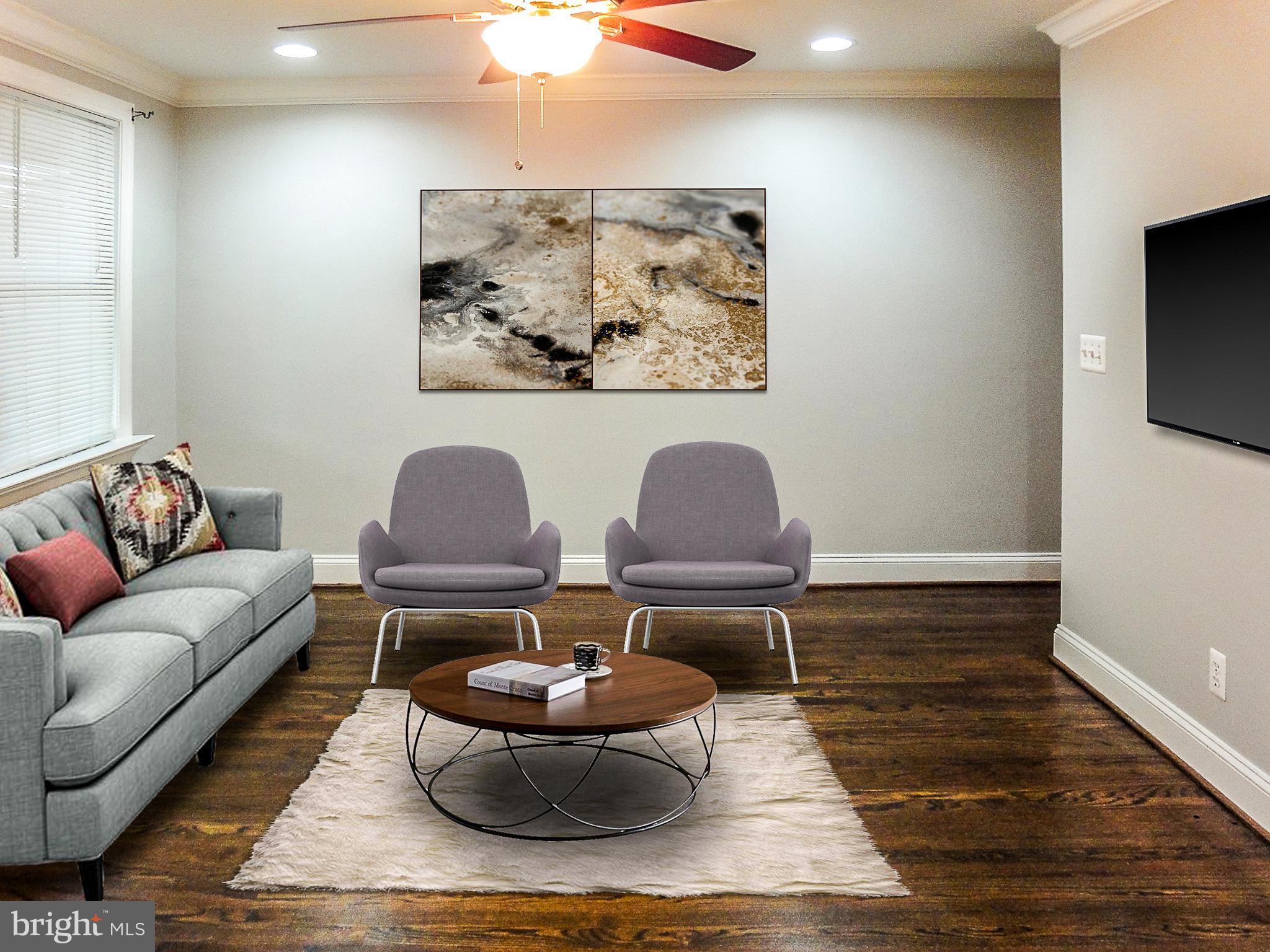 1803 Dunmere Road Baltimore, MD 21222 - Photo 2 of 14 Living room with newly stained hardwood floors
